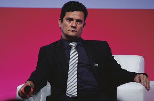 Sergio Moro, federal judge responsible for the investigations of corruption scandal at the country's state-run oil company Petrobras, speaks during a economic forum seminar in Sao Paulo, Brazil, Monday, Aug. 31, 2015. (AP Photo/Andre Penner)