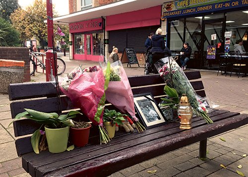 In this photo taken on Thursday, Oct. 20, 2016, flowers and candles are seen in a memorial to Arkadiusz Jozwik in Harlow, England. On Aug. 27, Arkadiusz Jozwik, known as Arek, was involved in an altercation with youths outside a pizza parlor in Harlow, about 20 miles (32 kilometers) north of London. The 40-year-old was felled by a single punch, hit his head and died in hospital two days later. Police said they were investigating the death as a hate crime, and arrested six teens aged 15 and 16. Poland's ambassador to Britain, Arkady Rzegocki, said he was "shocked and deeply concerned" by the hostility toward the Polish community. (AP Photo/Jill Lawless)