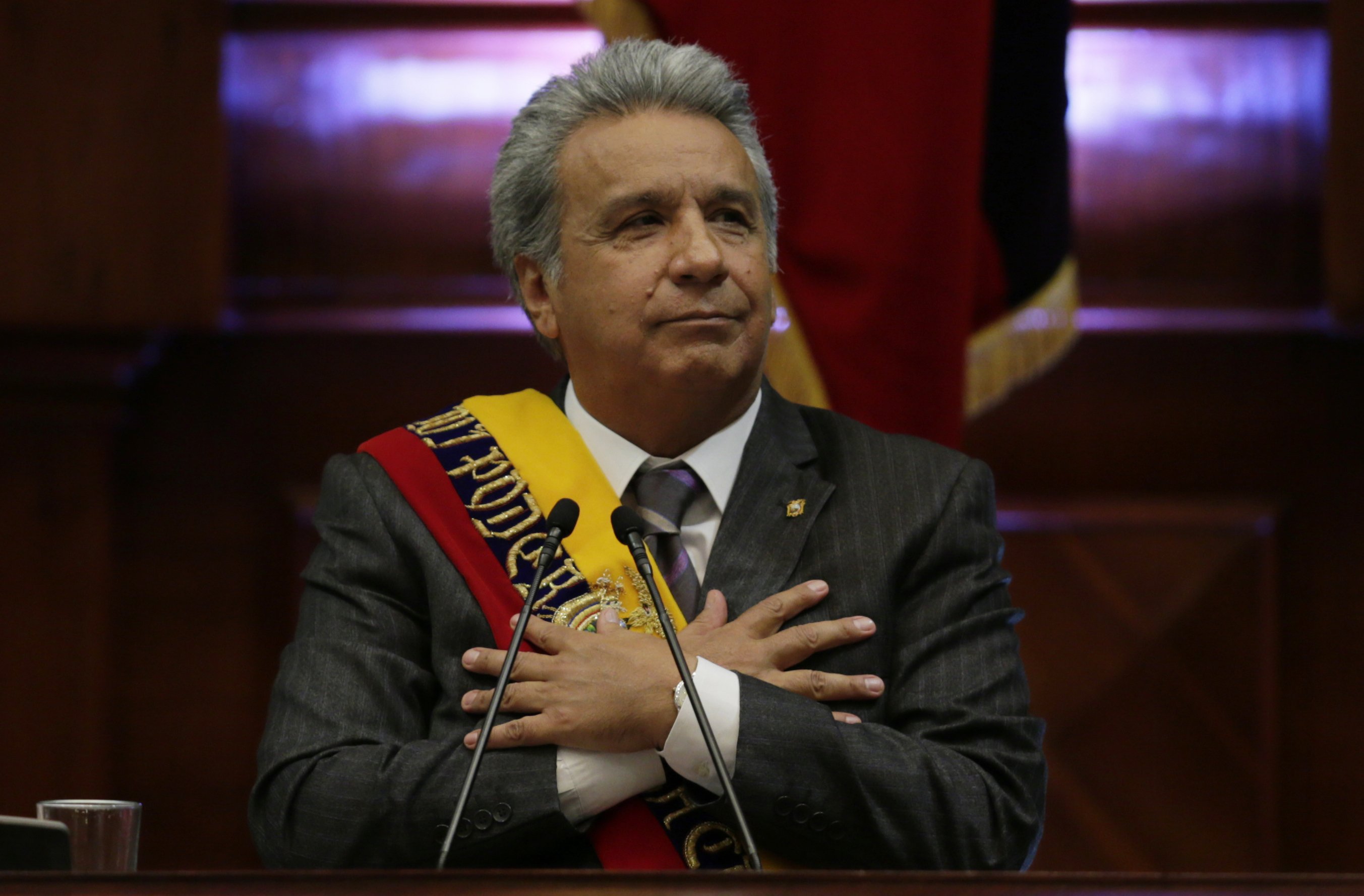 Ecuador's President Lenin Moreno delivers his first, annual state-of-the-nation address inside the National Assembly in Quito, Ecuador, Thursday, May 24, 2018. The first year of Moreno's administration has been marked by the ongoing political feud with his predecessor Rafael Correa. (AP Photo/Dolores Ochoa)